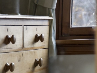 close up shot of wooden chest of drawers
