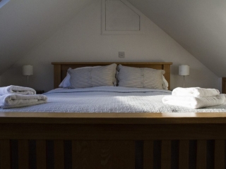 beautiful bedroom shot, showing luxury linens and attention to detail