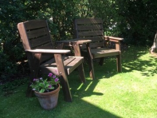 wooden garden chairs for guests to enjoy the Skye sunshine